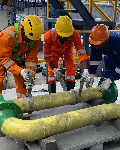 Rigging crew securing equipment safely on site